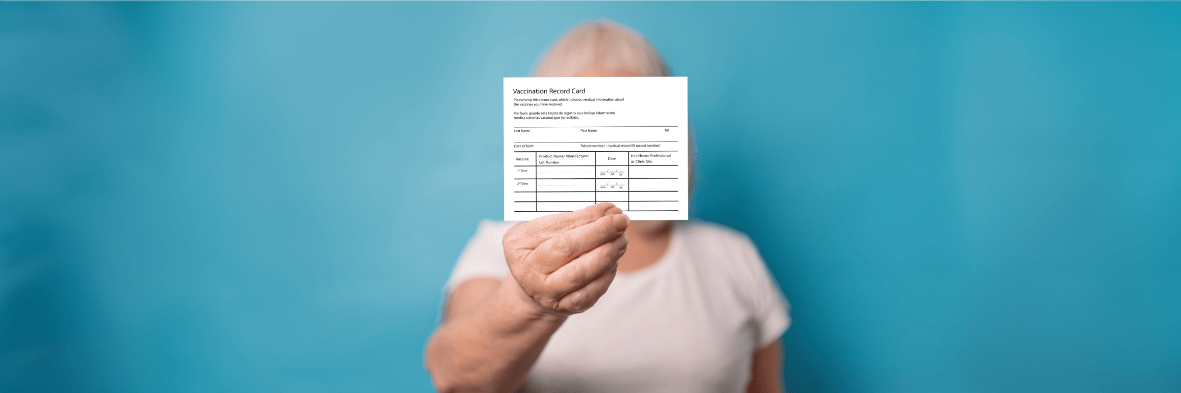 Patient holding up vaccination record card